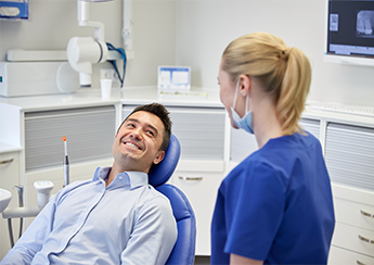 Dentist Talking With Patient